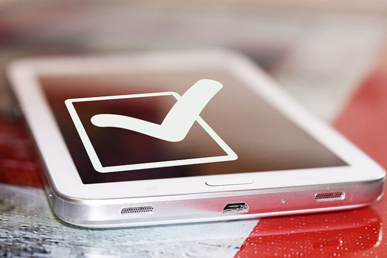 Tablet with a check mark representing, simple, reliable visitor management.